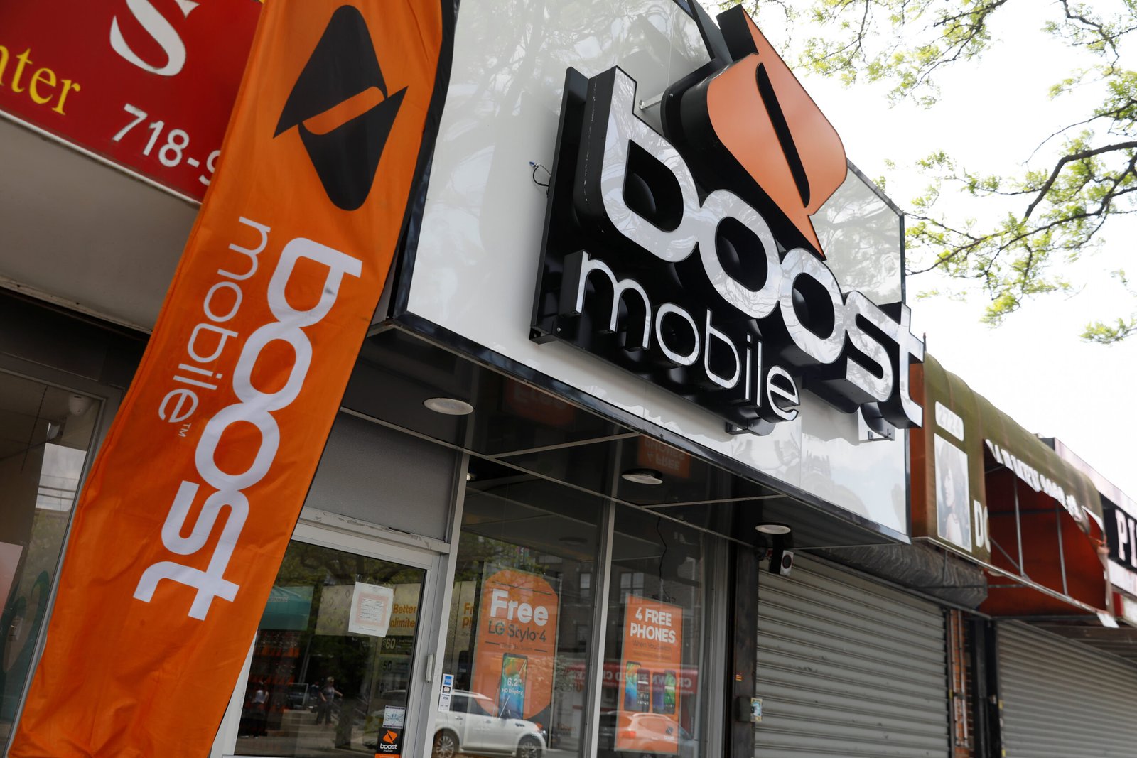 who owns boost mobile