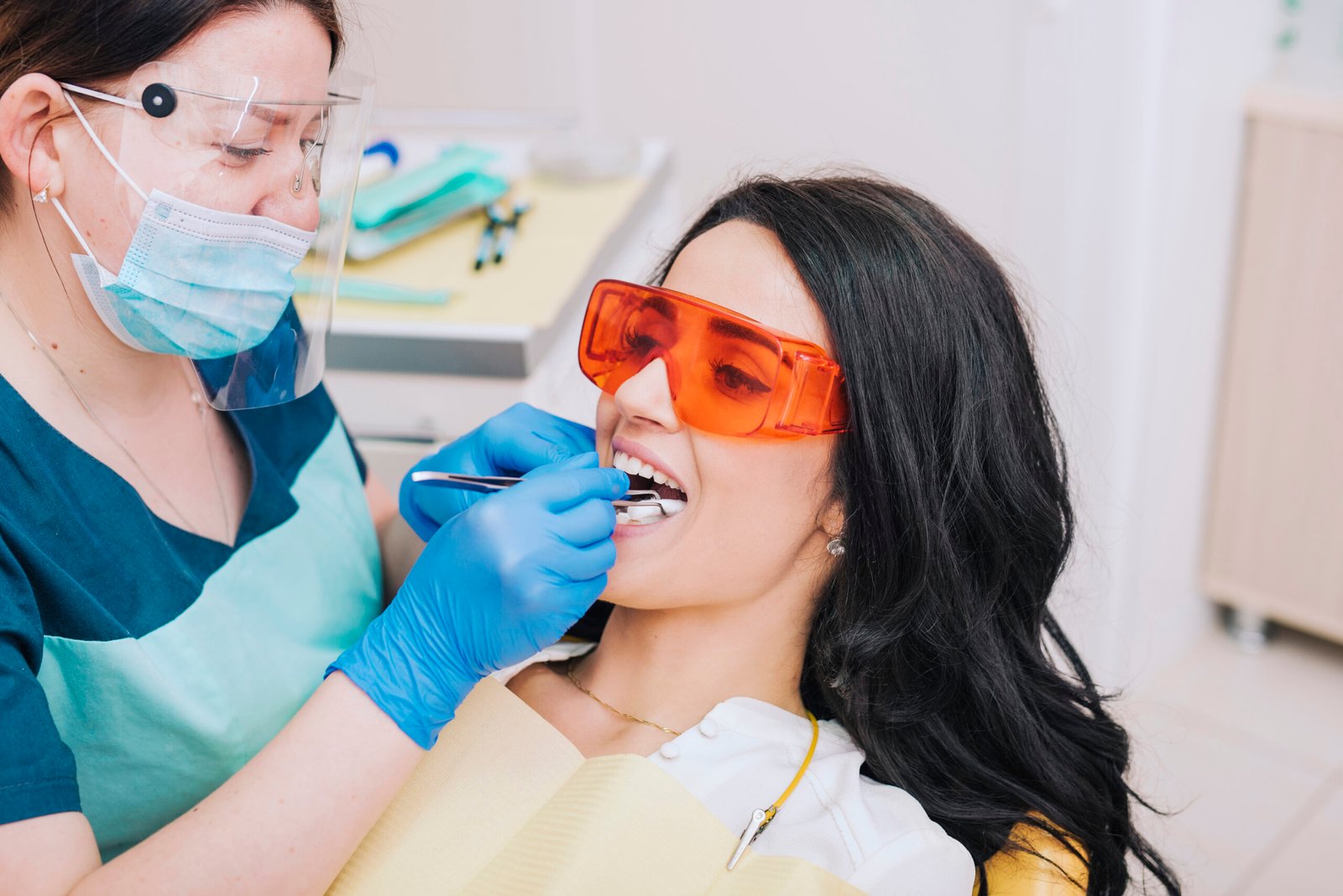 Dental procedure with dentist preparing patient for gum contouring